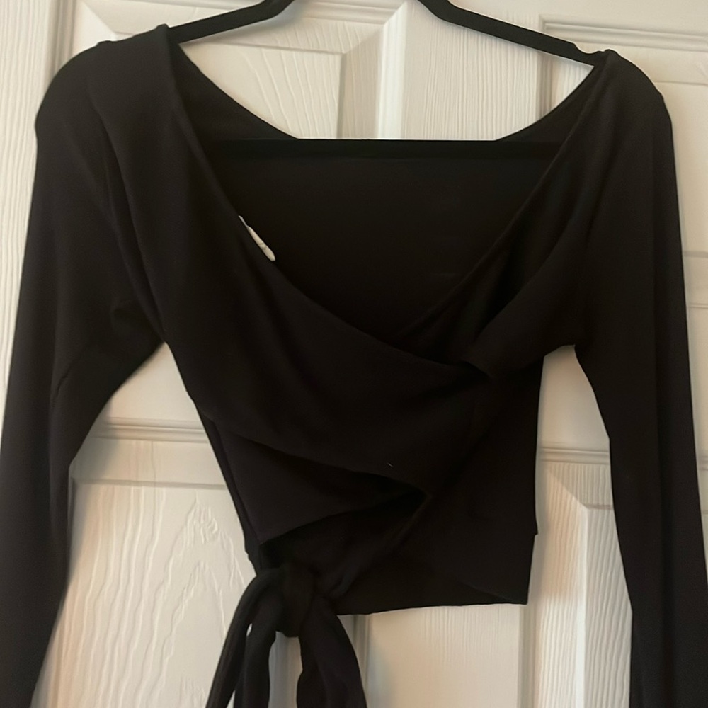 Ribbed long sleeve top that crosses in the back and ties